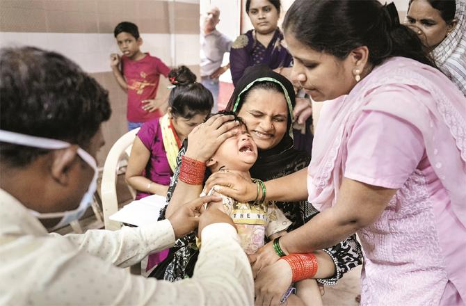 A child is being vaccinated against measles at a health post. (Photo: PTI)