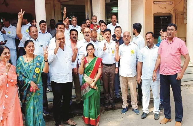 Candidates of Girish Mahajan`s panel showing the victory sign.