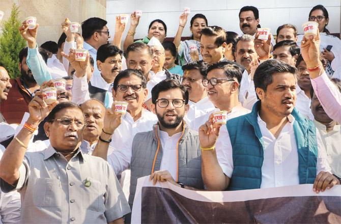 Members of this position distributing shri khand against the Chief Minister in Bhokhand (land) scam. (Photo, PTI)