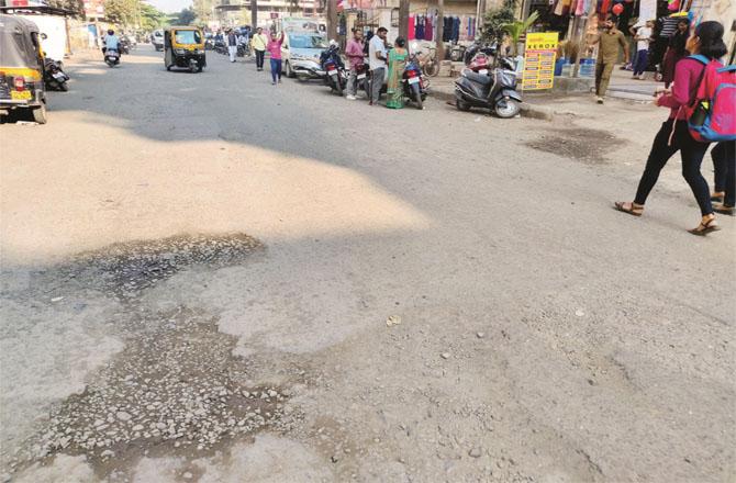 Potholes are visible on the roads of the Phase-I area, causing inconvenience to pedestrians and motorists. (Photos: Al-Inquilab)