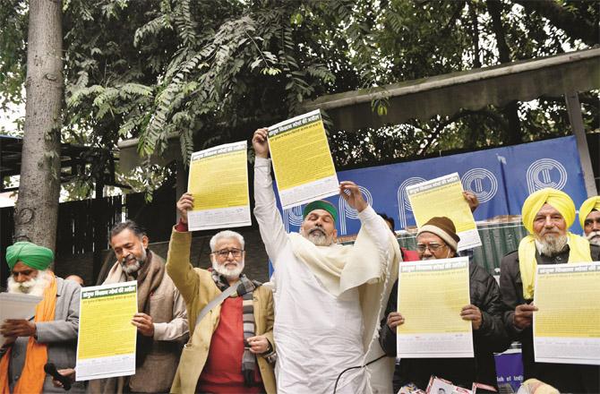 Farmer leaders at a press conference showing the leaflets that will be distributed to UP voters. Picture: PTI