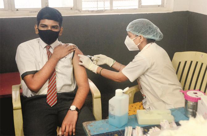 A schoolboy receiving a vaccine against covid 19. (File photo)