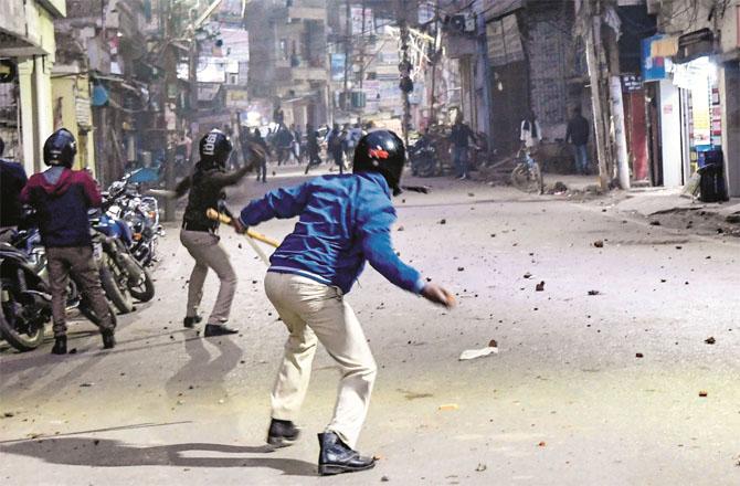 Patna, angry students pelted stones at police, prompting police to take defensive action and then retaliate. (Photo: PTI)