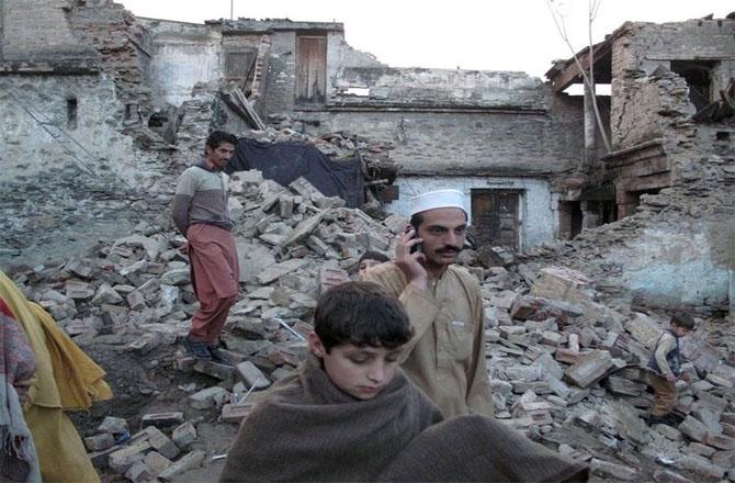 Affected people can be seen searching for essential items in the rubble of their homes.