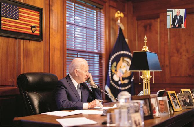 US President Joe Biden talking to Vladimir Putin (Inset) on the phone (Agency)
