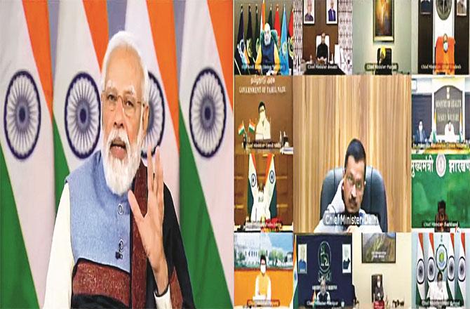 Prime Minister Modi talking to the Chief Ministers of the states in a virtual meeting. (PTI)