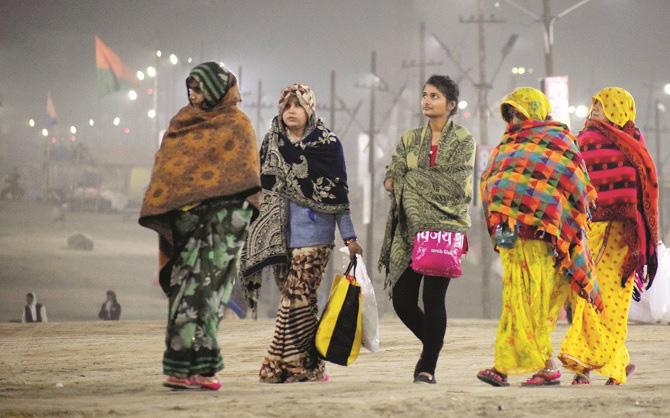 Women in warm clothes at Prayag Raj Magh Mela.Picture:INN