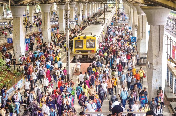 Passengers at Vashi station can be seen worried as train services are affected. (Photo: PTI)