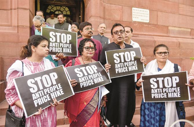 TMC members also protesting outside the House. (Photo: PTI)