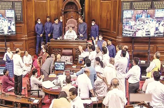 In the upper house, opposition MPs can be seen surrounding the chamber