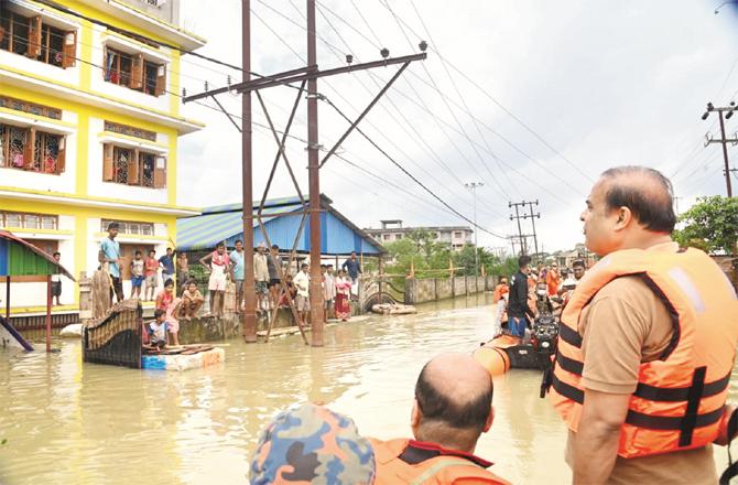 Assam Chief Minister Hemant Biswa Sharma inspecting the flood-hit area.