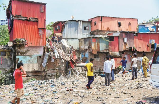 The wreckage of a collapsed house can be seen in Bandra, the rubble of which was removed overnight (PTI)