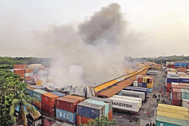 The picture above shows heavy smoke billowing from the center of a Bangladeshi container depot..Picture:INN