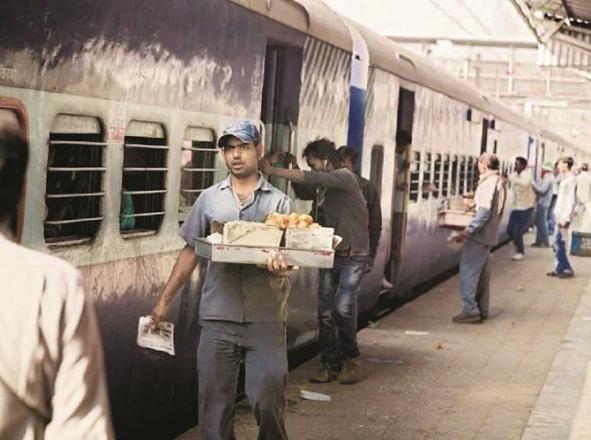 A hawker sells samosas at a train station.Picture:INN