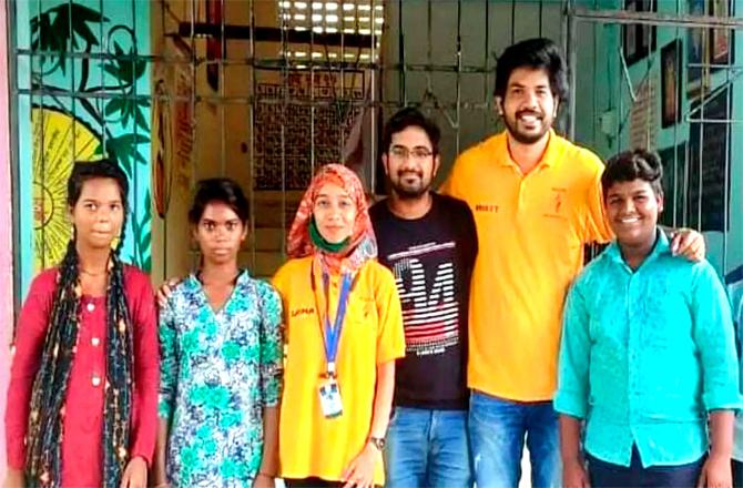 Avinash Waghe and Deepali Katkari with volunteers who help educate children in the tribal areas