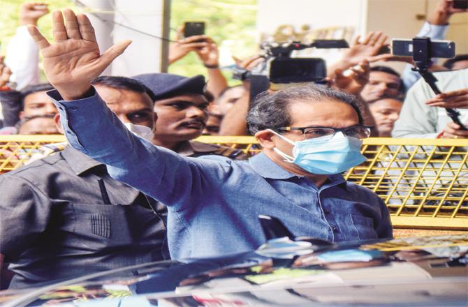 The Chief Minister can be seen outside Sena Bhawan in Mumbai. He was here to attend a meeting of the party`s National Working Committee. (Photos: PTI)