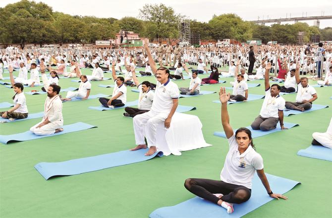 Vice President Venkaiah Naidu and badminton player PV Sindhu can be seen doing yoga in Secunderabad.