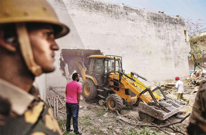 The bulldozer operation has become a symbol of government repression in Uttar Pradesh. (Photo: PTI)