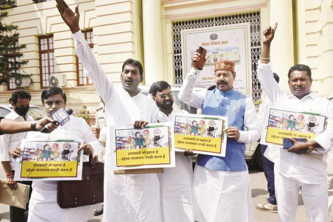 Outside the assembly, RJD members are protesting against poisonous alcohol deaths..Picture:PTI