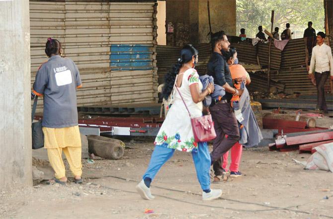 Fake clean-up marshals, including women, flee after seeing police.