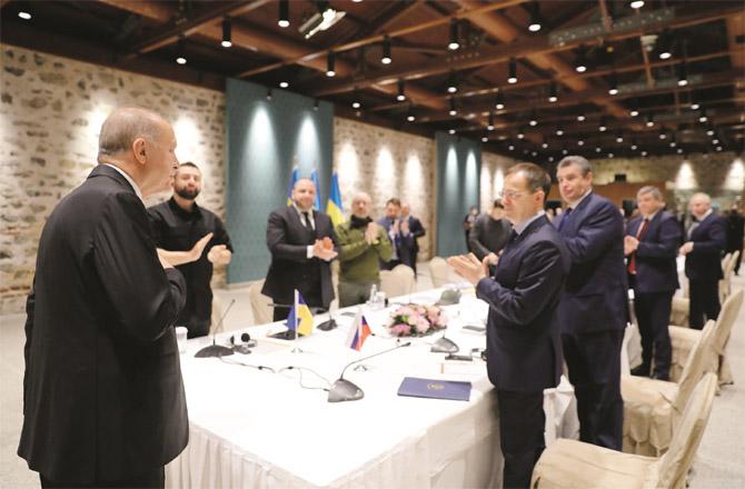 Turkish President Recep Tayyip Erdogan welcomes Russian and Ukrainian negotiators in Istanbul.