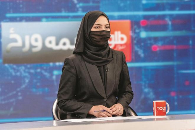  Anchor of Afghan TV channel Tolo News reading news in niqab.Picture:INN