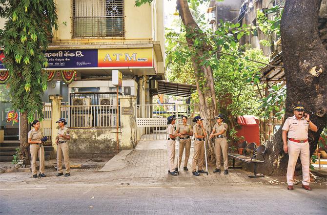 Security personnel can be seen outside during the raid on the tune. (Photo: PTI)