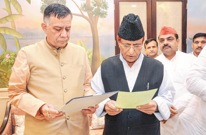 Azam Khan taking oath of membership in the chamber of Speaker Satish Mahana