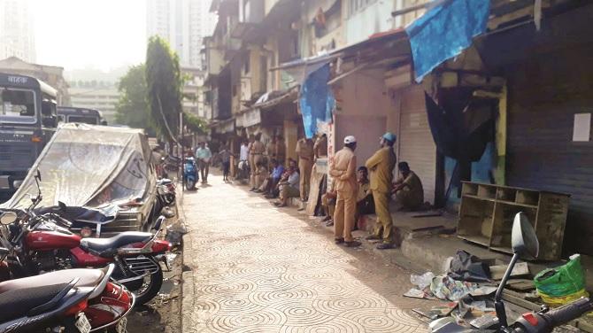 BMC and police personnel are seen under the long cement walk.Picture:Inquilab