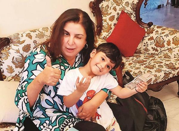  Farah Khan can be seen with Sania Mirza`s son.Picture:INN