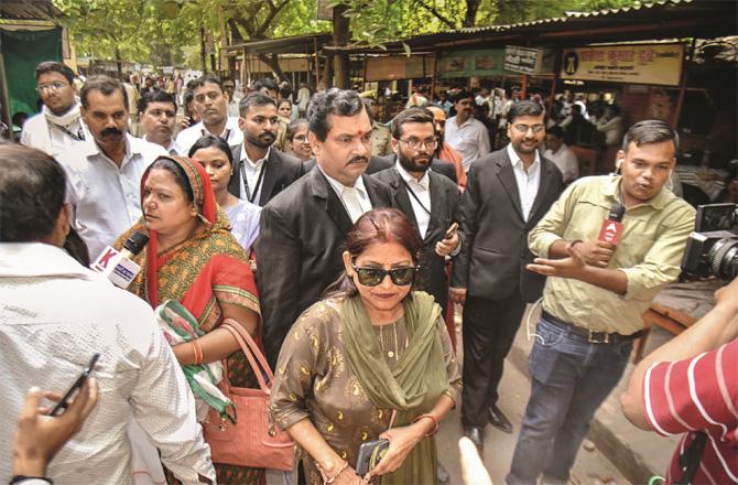 The women who filed the case against Gyan Vapi Mosque and their lawyers talking to the media outside the court. (PTI)