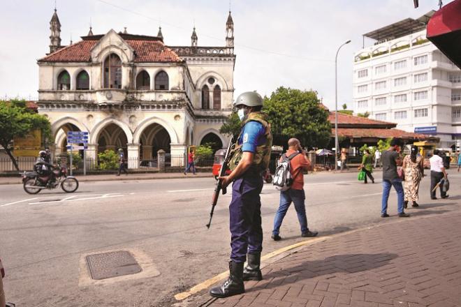 A roadside security guard is seen in Colombo..Picture: PTI/AP