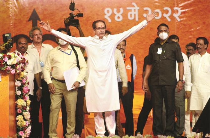 Uddhu Thackeray welcoming party workers from the stage during a rally in BKC.
