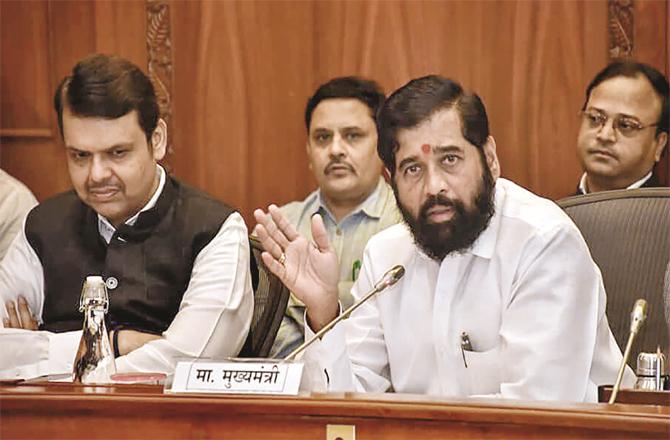 Chief Minister Eknath Shinde with Deputy Chief Minister Devendra Farnavis on Monday. (PTI)