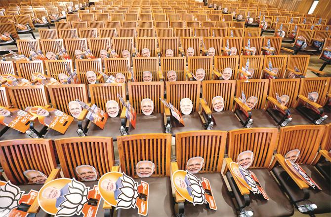 On the occasion of Modi`s rally, masks and party symbols were placed on chairs for the public.