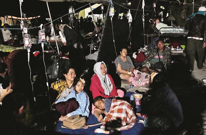 Mothers with their children outside a hospital in Sianjur.Picture: PTI