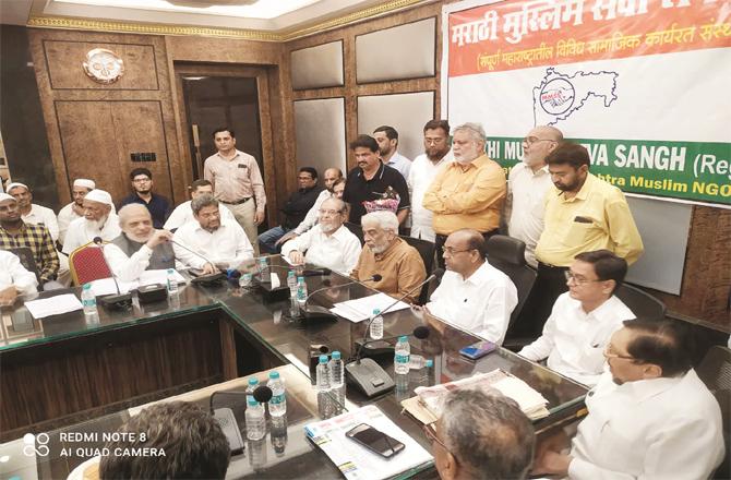Officials of Muslim Sangh and former central Anand Geeta talking in a meeting held at Islam Gymkhana.
