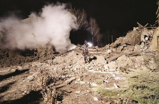 Ukrainian soldiers on the ruins of a hospital in Zaporizhia. Picture:AP/PTI