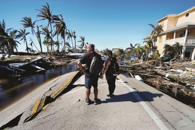A couple in Florida amid stormy winds.Picture:AP/PTI