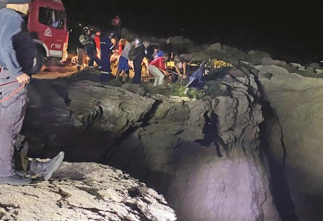 Rescue workers and local people engaged in search operation.Picture:AP/PTI
