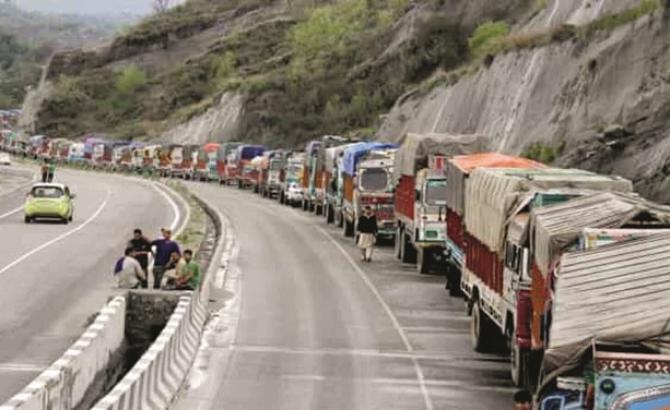 A line of trucks can be seen on the road in Kashmir .Picture:Agency