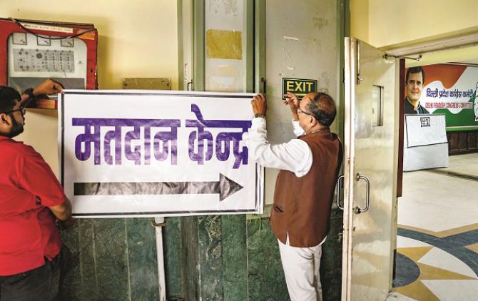 Party workers preparing a polling booth at the Delhi Congress office.Picture:PTI