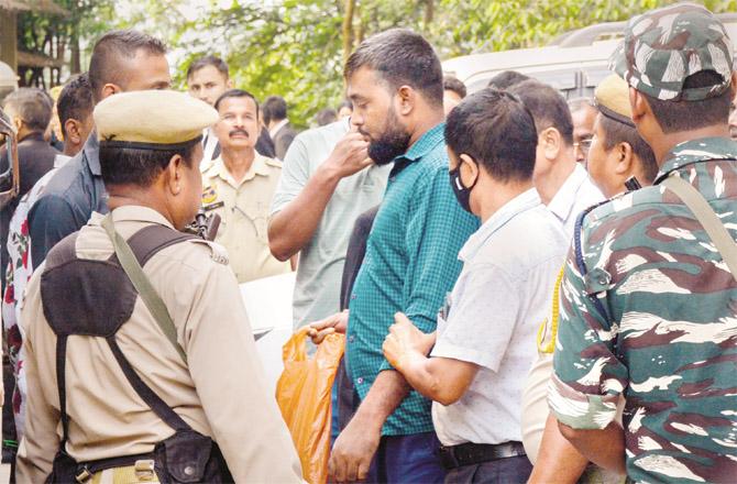 A PFI worker is being taken to court in Guwahati. 25 people were arrested in Assam. (Photo: PTI)