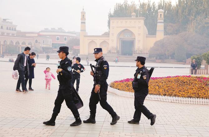 Chinese security personnel on patrol in Xinjiang. (AP/PTI)