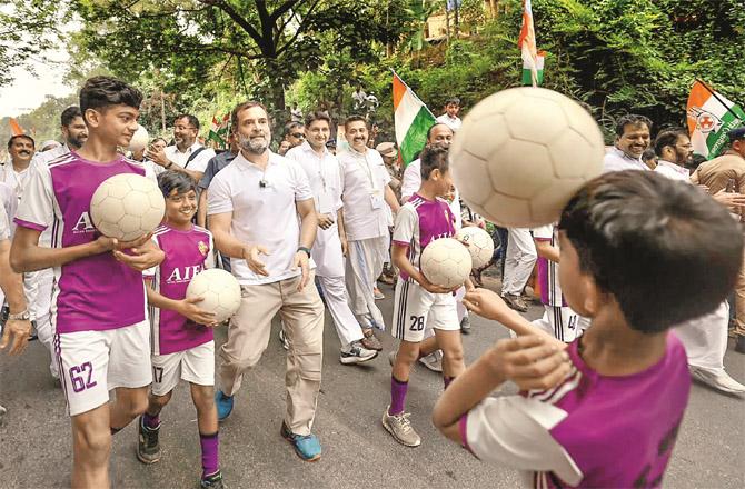 Rahul Gandhi playing football with a group of students coming to join Yatra