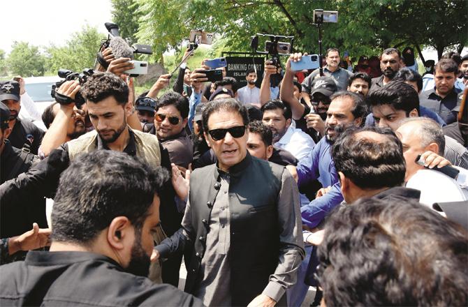 Imran Khan among his supporters outside the Anti-Terrorism Court