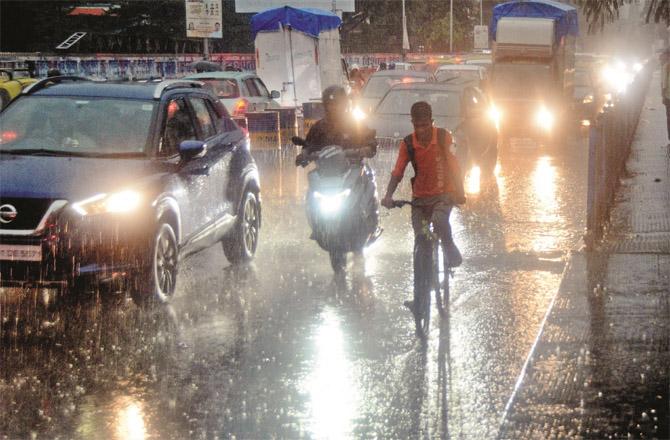 Vehicles are seen stuck in traffic in Dadar during heavy rains.