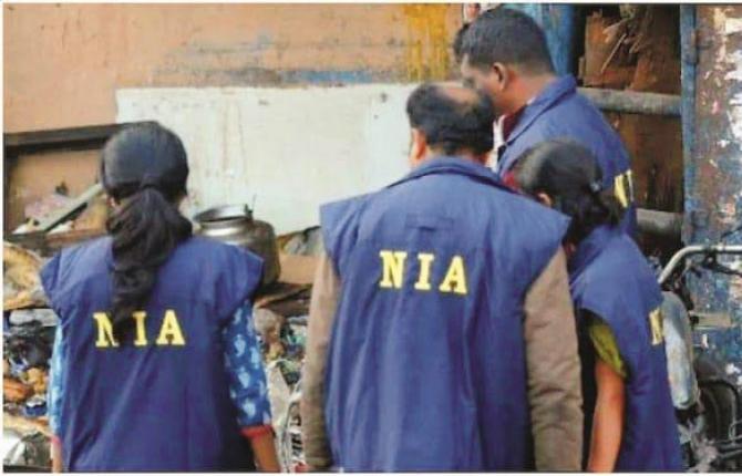 NIA officers can be seen inspecting a PFI hideout during a raid..Picture:INN