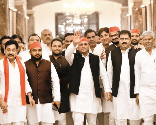 Samajwadi leader Akhilesh Yadav with his party workers coming out of the assembly session. (PTI)