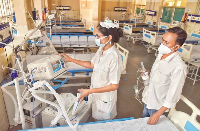 Hospital staff inspecting medical machines during a mock drill at a hospital in Hyderabad